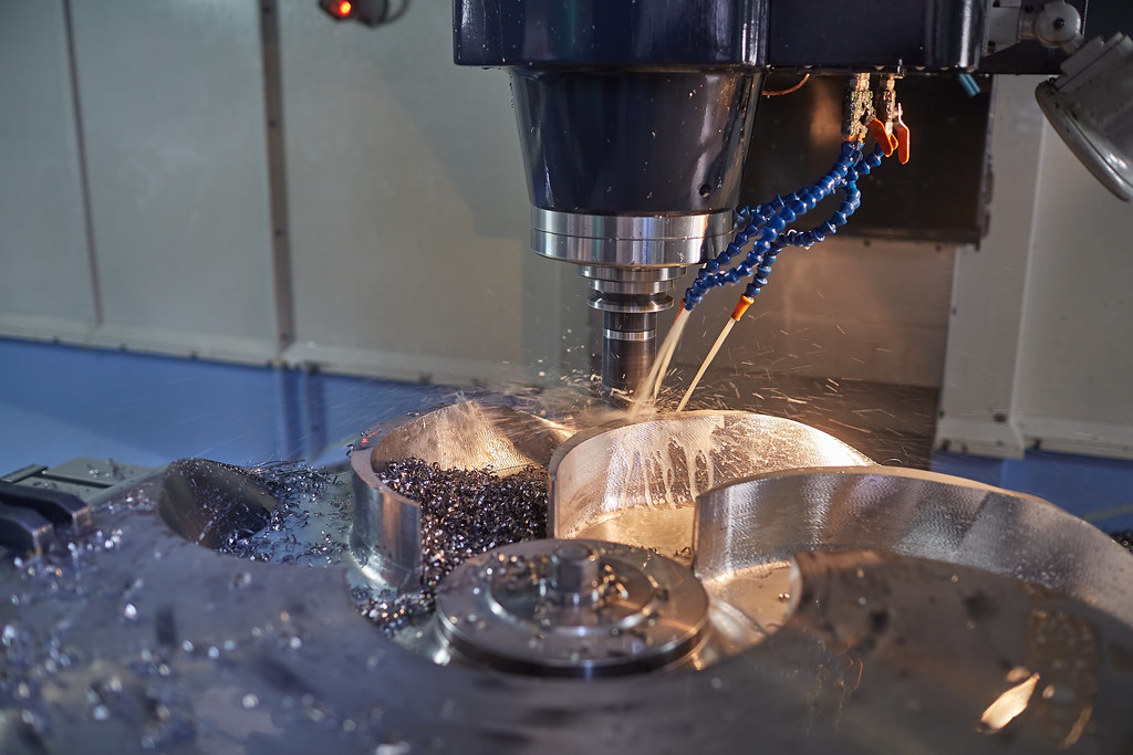 5-axis CNC machining a precision part at the MechPart factory